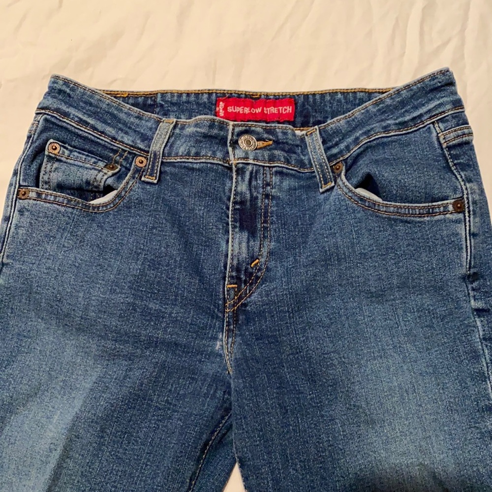Levi’s blue jeans, stretch, super low bootcut, 7